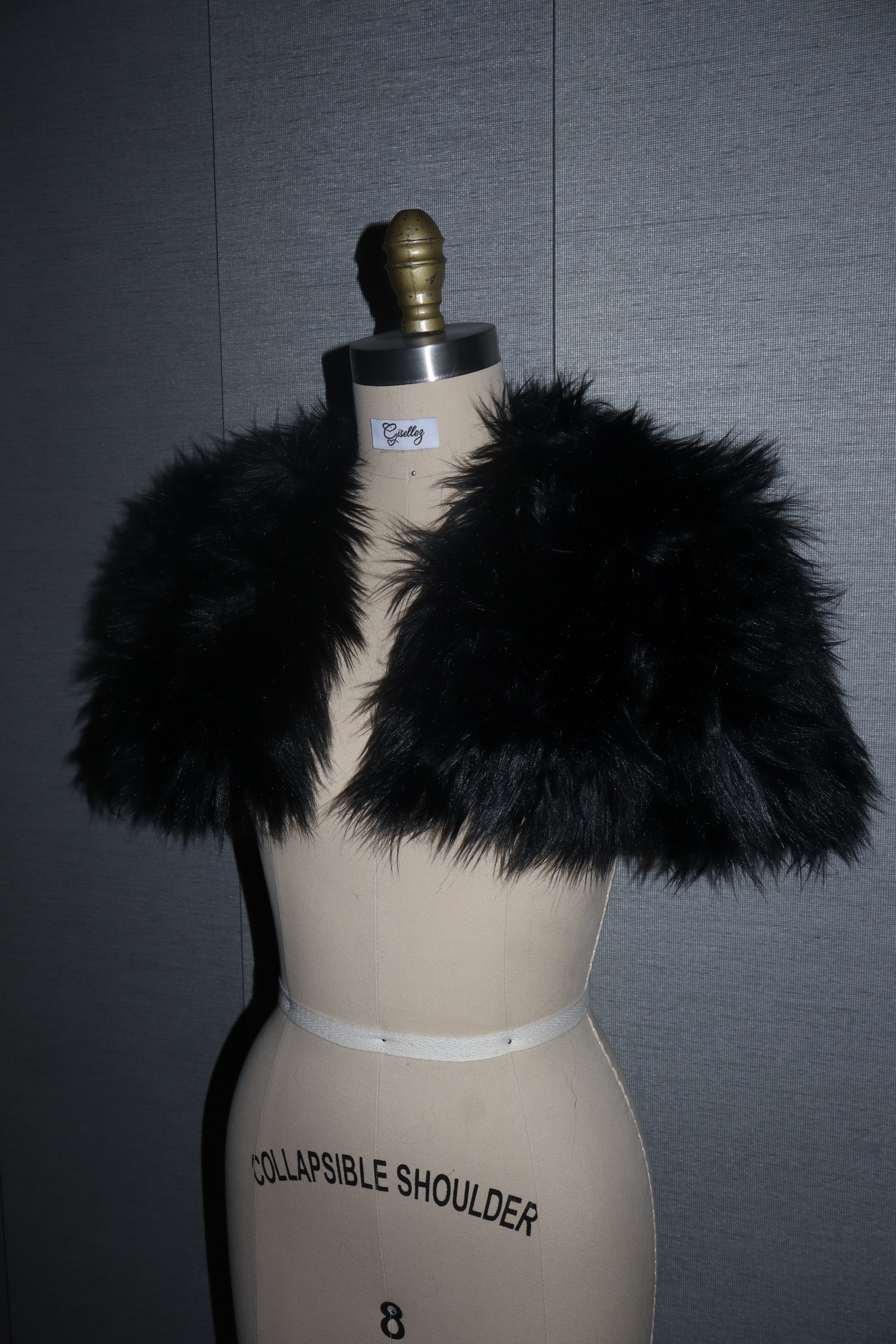 Faux Fur Shrug In Black